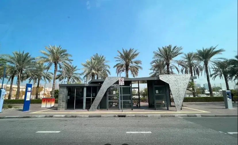 Satwa Roundabout bus stop location in Al Satwa Dubai with buses and road view